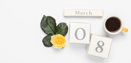 Calendar with date of International Women's Day, cup of coffee and rose flower on light background with space for text