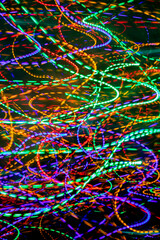 abstract texture of bright multicolored streams of light