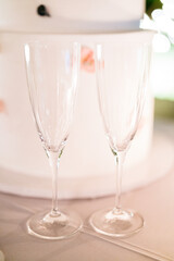 Two empty glasses of wine on white table