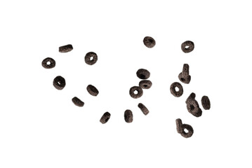 Chocolate rings cereal spill out into a bowl. Breakfast.