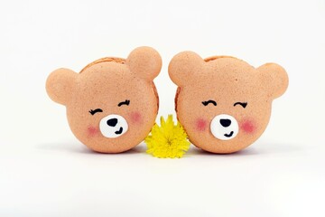 Cute macarons in a shape of bears with flower