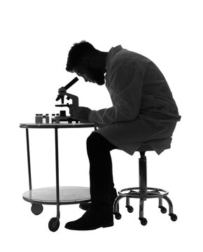 recommend clip art: Silhouette of male scientist working with microscope on white background