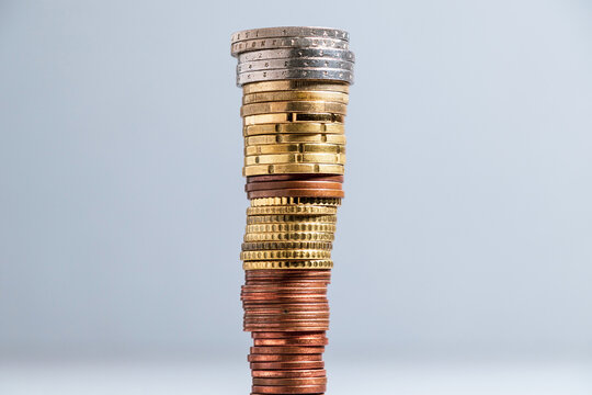 High stack of coins. Euro coins stacked in a pile
