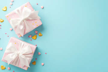 Valentine's Day concept. Top view photo of pastel pink gift boxes with white ribbon bows golden hearts and sprinkles on isolated light blue background with copyspace