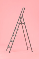 Maintenance ladder on pink background