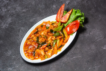Sweet and Sour Chicken served in dish isolated on grey background top view of indian and bangladesh food