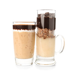 Shots of delicious pudding with chocolate and cinnamon isolated on white background