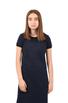 Young beautiful girl in a dark blue dress on a white background