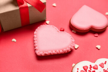 Delicious heart shaped cookies on red background, closeup. Valentine's Day celebration
