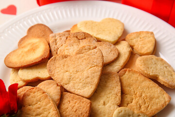 Plate with tasty heart shaped cookies, closeup. Valentines Day celebration
