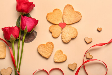Fototapeta na wymiar Composition with sweet heart shaped cookies, ribbon and rose flowers on color background. Valentines Day celebration