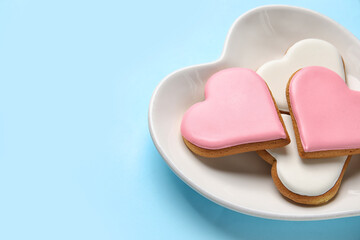 Plate with tasty heart shaped cookies on color background, closeup. Valentines Day celebration
