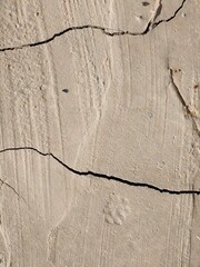 An old wall with cracks. Abstract texture background. Close-up of old plaster on the wall.