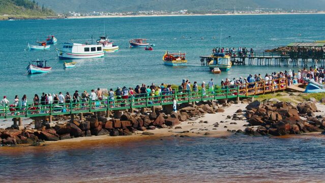 People wait in the queue to the transfer boat during New Year holidays in Brazil