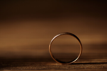golden ring close-up, macro, on a wood background