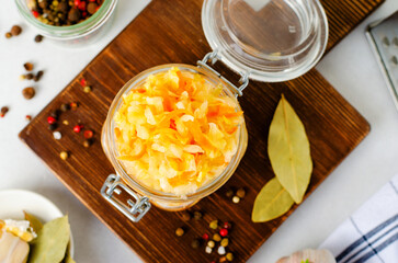 Sauerkraut, Shredded cabbage, apples, and carrots on bright rustic background, Fermented Food, Healthy Eating