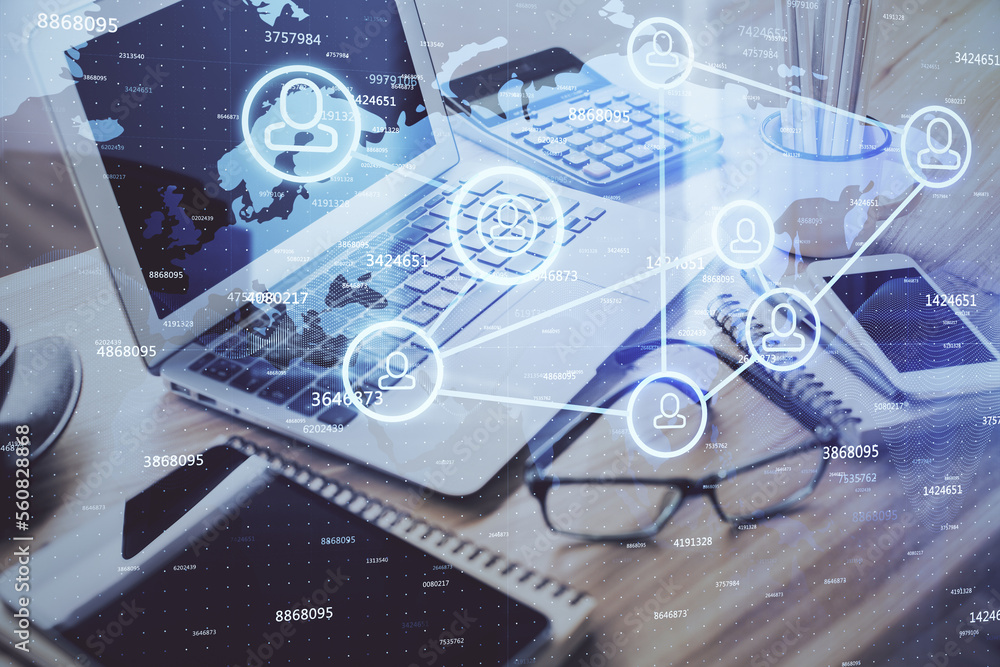 Poster computer on desktop with social network hologram. double exposure. concept of international people c