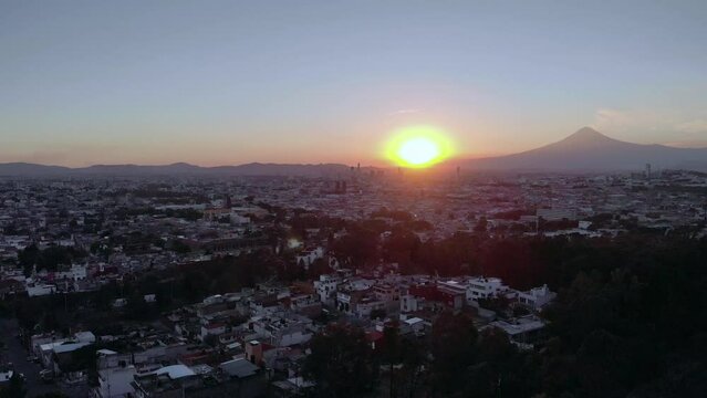 Puebla at Dramatic evening Sunset aerial drone shot of City Center in Puebla de Zaragoza, Puebla State, Mexico