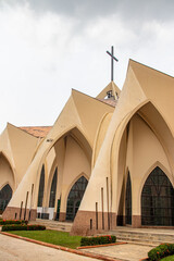 Exterior with arches, crosses, decorative walls of Catholics church in Abuja, church is known as...