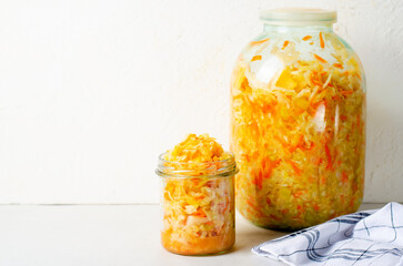 Sauerkraut, Shredded cabbage, apples, and carrots on bright rustic background, Fermented Food, Healthy Eating