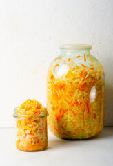 Sauerkraut, Shredded cabbage, apples, and carrots on bright rustic background, Fermented Food, Healthy Eating