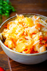 Sauerkraut, Shredded cabbage, apples, and carrots on dark rustic background, Fermented Food, Healthy Eating