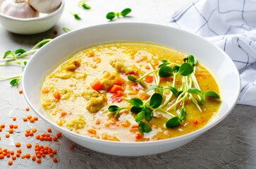 Lentil Soup, Homemade Vegetable Soup with Chicken and Herbs on Bright Background, Healthy Eating