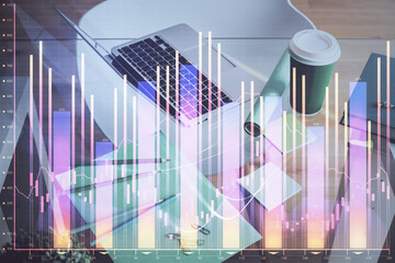 Financial graph colorful drawing and table with computer on background. Double exposure. Concept of international markets.