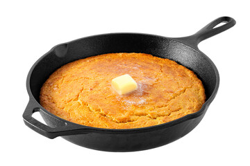 Freshly baked corn bread topped with melting butter in a cast iron skillet