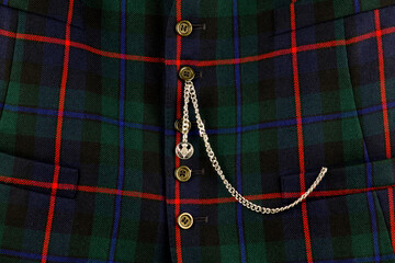Scottish Tartan Waistcoat with Gold Watch Chain Closeup - 560839613