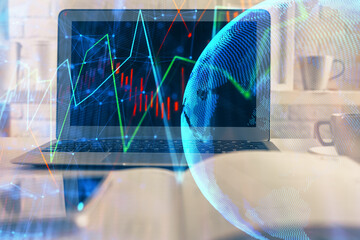Financial graph colorful drawing and table with computer on background. Double exposure. Concept of...