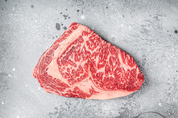 Japanese wagyu rib eye beef meat steak. Gray background. Top view