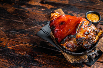 Bavarian Schweinshaxe Roast pork Hock Ham, knuckle with Sauerkraut. Wooden background. Top view. Copy space - obrazy, fototapety, plakaty