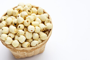 Dried lotus seeds on white background.