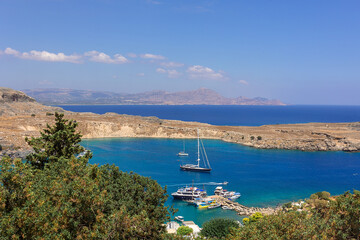 Panoramic view of colorful harbor in Lindos village, Rhodes. Aerial view of beautiful landscape,...