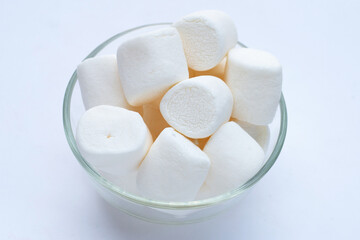 Fototapeta na wymiar White marshmallows on white background.