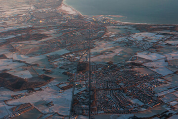 Frozen landscape at sunrise from the air