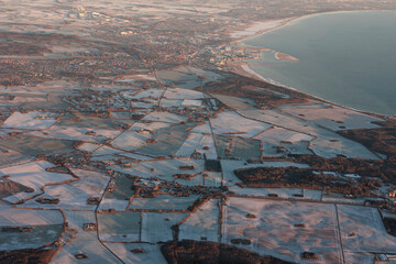 Frozen landscape at sunrise from the air