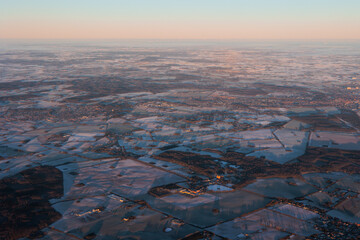 Frozen landscape at sunrise from the air