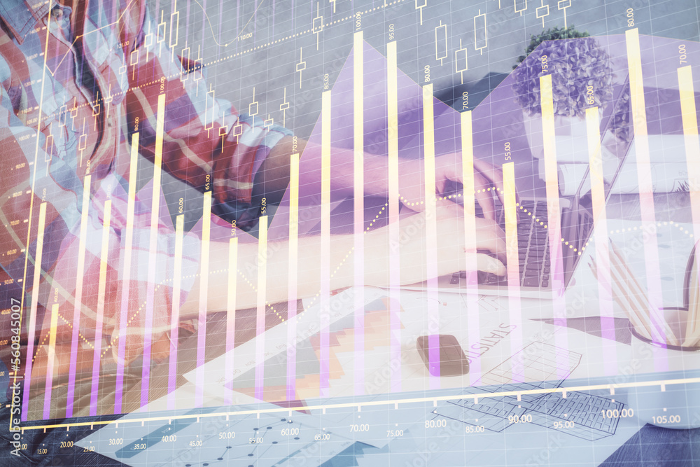 Poster Double exposure of stock graph with businessman typing on computer in office on background. Concept of hard work.