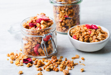 Granola with Dried Berries on Bright Concrete Background, Healthy Vegan Snack or Breakfast