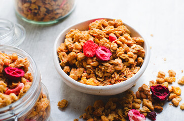 Granola with Dried Berries on Bright Concrete Background, Healthy Vegan Snack or Breakfast