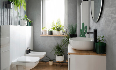 Modern bathroom with stylish design. Washroom in cozy interior with ceramic washbasin, toilet and...