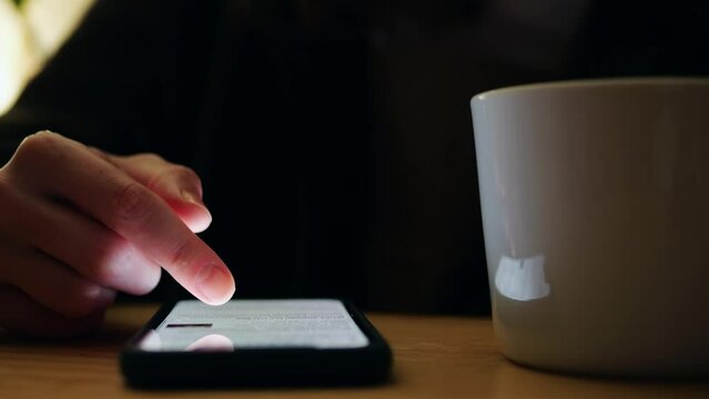 Woman chatting online on smartphone macro close up, typing text message, touching touchscreen keyboard, using messenger application. Female holding mobile phone, close up, swiping social media. 