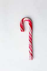 Classic glossy red and white christmas candy cane isolated on white background