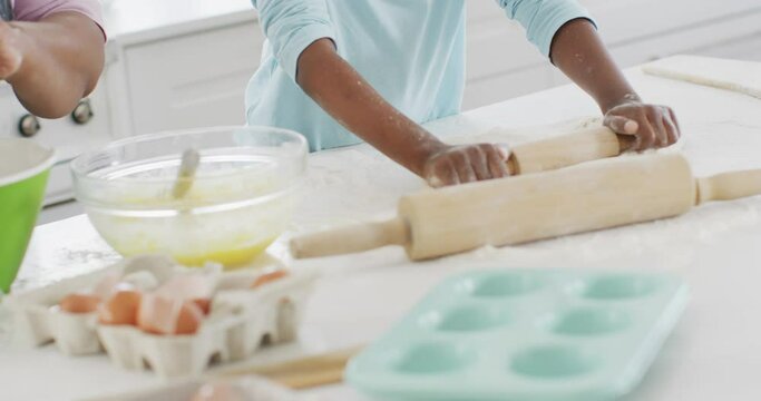 Happy African American Grandmother And Granddaughter Baking In Kitchen, High Fiving, Copy Space