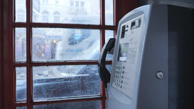 A view from inside a London telephone booth.