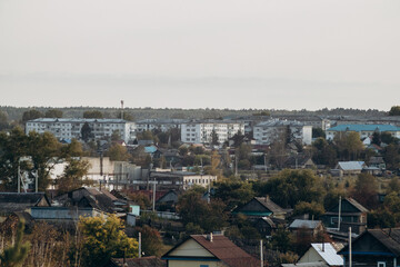 Fototapeta premium View of a small town, surrounded by forest and nature. City landscape.