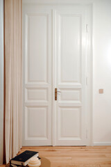 Stylish white wooden doors in fancy apartment, luxury estate