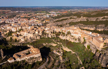 Picturesque view from drone of historic district of Cuenca city on steep spur above deep gorges of...